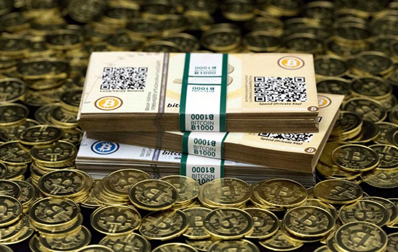Some of Bitcoin enthusiast Mike Caldwell's coins and paper vouchers, often called "paper wallets", are pictured in this photo illustration taken in Sandy, Utah on January 31, 2014. Caldwell recommended their use as a way to store Bitcoins offline. Mt. Gox, once the world's biggest bitcoin exchange, went dark on February 25, 2014, with its website down, its Tokyo office empty, and a cryptic comment from its chief executive that the business was at "a turning point." REUTERS/Jim Urquhart/Files (UNITED STATES - Tags: BUSINESS)