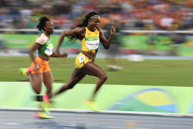 Jamaica's Elaine Thompson (R) competes in the Women's 100m Final during the athletics event at the Rio 2016 Olympic Games at the Olympic Stadium in Rio de Janeiro on August 13, 2016.   / AFP PHOTO / Fabrice COFFRINI