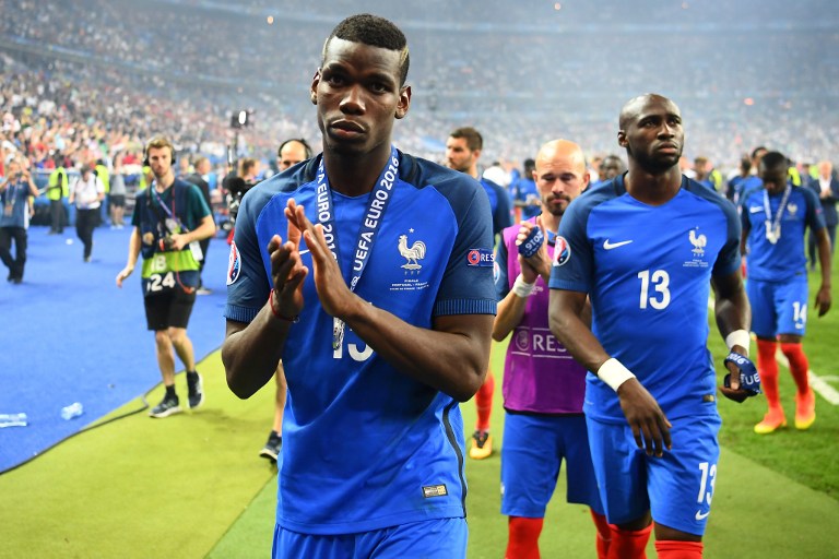 France's midfielder Paul Pogba acknowledges the fans after France lost to Portugal 1-0 in Euro 2016 final football match between France and Portugal at the Stade de France in Saint-Denis, north of Paris, on July 10, 2016. Portugal beat France 1-0 to clinch the Euro 2016. / AFP PHOTO / FRANCK FIFE