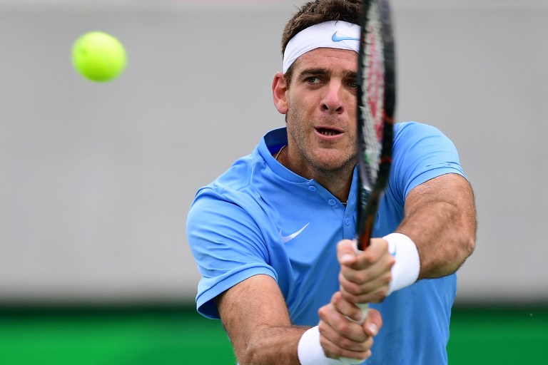 Argentina's Juan Martin Del Potro returns the ball to Portugal's Joao Sousa during their men's second round singles tennis match at the Olympic Tennis Centre of the Rio 2016 Olympic Games in Rio de Janeiro on August 8, 2016. / AFP PHOTO / Martin BERNETTI