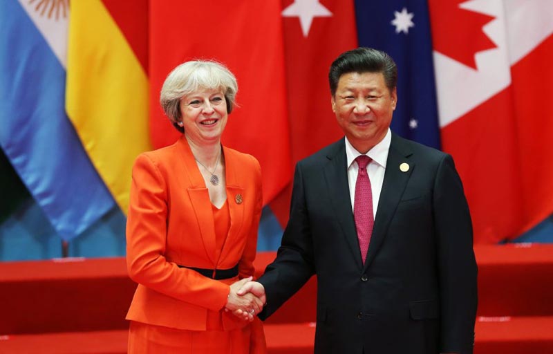 epa05523285 Chinese President Xi Jinping (R) welcomes British Prime Minister Theresa May (L) for the G20 Summit in Hangzhou, China, 04 September 2016. The G20 Summit is held in Hangzhou on 04 to 05 September. EPA/HOW HWEE YOUNG