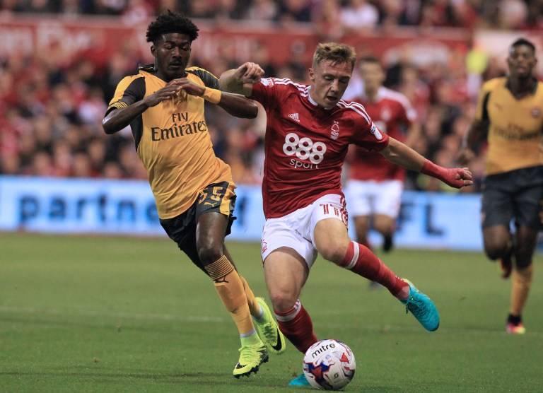 Arsenal's English midfielder Ainsley Maitland-Niles (L) vies with Nottingham Forest's English midfielder Ben Osborn during the English League Cup third round football match between Nottingham Forest and Arsenal at The City Ground in Nottingham, central England on September 20, 2016. / AFP PHOTO / Lindsey PARNABY / RESTRICTED TO EDITORIAL USE. No use with unauthorized audio, video, data, fixture lists, club/league logos or 'live' services. Online in-match use limited to 75 images, no video emulation. No use in betting, games or single club/league/player publications.  /