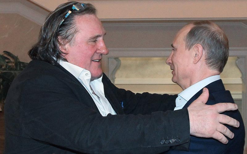 Gerard Depardieu, Vladimir Putin...French actor Gerard Depardieu, left, greets Russian President Vladimir Putin after his arrival late Saturday, Jan. 5, 2013, at the president's residence in Sochi, the host city of the 2014 Winter Olympics. Depardieu has received a Russian passport after flying to Russia for a late night dinner with Putin. Depardieu sought Russian citizenship as part of his battle against a proposed super tax on millionaires in France, and Putin granted his request last week. (AP Photo/RIA-Novosti, Mikhail Klimentyev, Presidential Press Service)